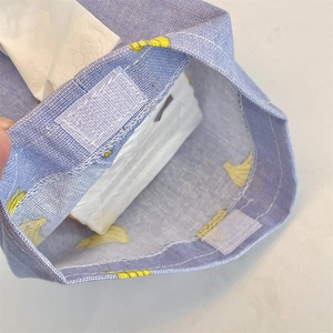 Macro detail of the fabric tissue bag showing high-quality stitching and velcro closure