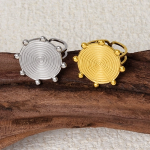 Adjustable 304 stainless steel rings with gold and silver spiral textured round discs