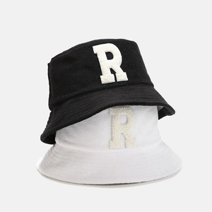 Sherpa fleece bucket hats with R patch in black and white colors for a cozy autumn look