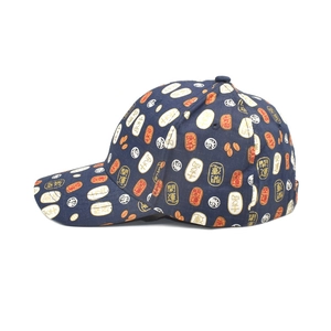 Detail of navy blue baseball cap featuring traditional lucky symbols and full print pattern
