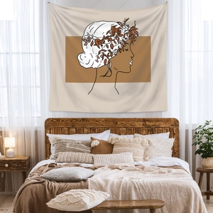 Detailed close-up of a Bohemian wall tapestry with a minimalist female line art design