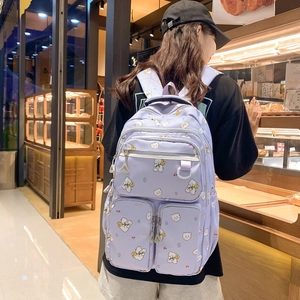Cute light purple school backpack with cartoon bear prints and multiple zipper pockets