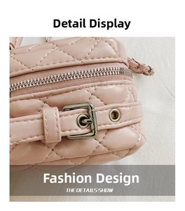 Detailed macro view of light pink quilted leather bag with silver zipper and buckle detail