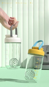 Detail of 750ml protein shaker bottle with measuring scale and stainless steel mixing ball