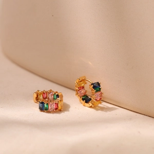 Rainbow huggie earrings with colorful baguette-cut stones in 18K gold-plated finish