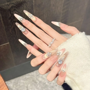 Pink and gold gradient stiletto press-on nails with luxury rhinestones and pearls