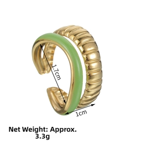 Detailed view of gold-plated double-layer ring with green enamel and embossed texture