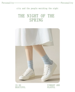 Cotton crew socks for women paired with white canvas sneakers, comfortable summer daily wear.