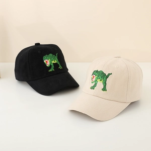 Close-up of dinosaur embroidery on black and beige cotton kids baseball caps