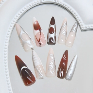Retro butterfly wing press-on nails in long stiletto shape with silver metallic accents