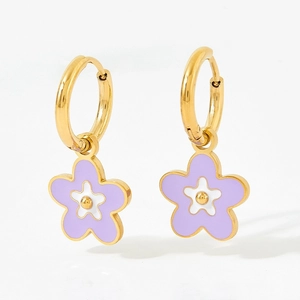 Golden hoop earrings with purple and white enamel flower pendants on white background