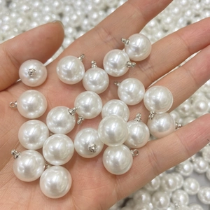 White high-luster faux pearl pendants with silver metal eyelet caps for DIY jewelry