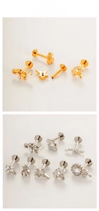 Flat lay display of titanium labret studs with zircon leaf, star and floral designs