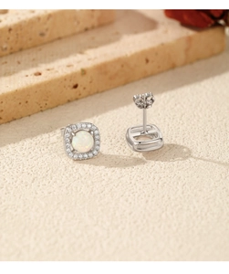 Detailed view of silver square opal stud earrings with halo diamonds and butterfly backings