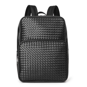 Detailed view of black woven leather texture and front zipper pocket on business backpack