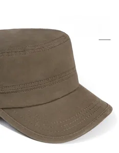 Detailed view of wide brim stitching and cotton twill texture on tan flat top cadet hat