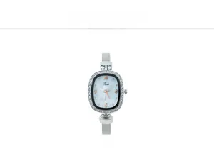 Close-up of white shell dial quartz watch with crystal bezel and silver mesh strap