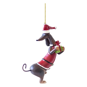 Brown dachshund dog Christmas tree ornament wearing red hat and holding a green gift box