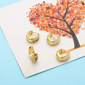 Golden huggie hoop earrings with colorful cubic zirconia stones and white crystal pavé