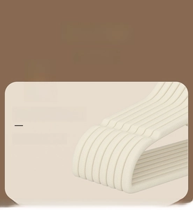 Macro detail of beige clothes hanger with non-slip texture and eco-friendly material