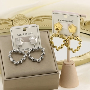 Retro geometric hollow heart earrings in gold and silver stainless steel finishes