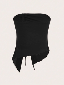 Detailed view of the black waffle knit tube top featuring drawstring and irregular split hem