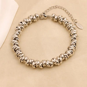 Detail of silver stainless steel twisted link bracelet with lobster clasp and extension chain