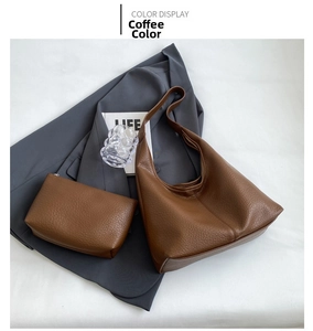 Detailed view of the large brown hobo bag and matching inner pouch with pebbled texture
