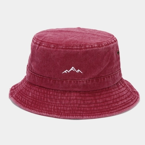 Detail of mountain embroidery and metallic eyelets on vintage wine red bucket hat