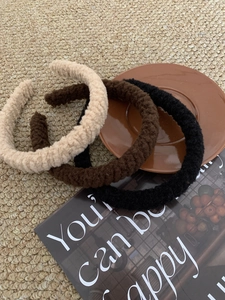 Three-piece set of plush sherpa headbands in beige, brown, and black colors