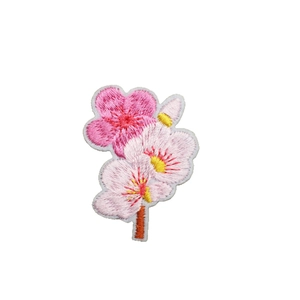 Exquisite pink cherry blossom embroidery patch with dense stitching on white background