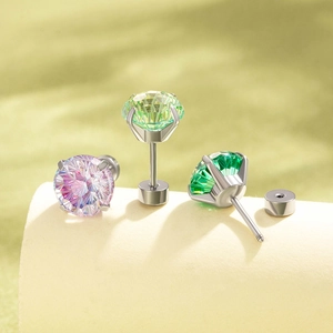 Titanium steel stud earrings featuring round cut zircons in pink and green colors