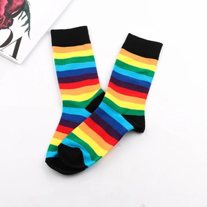Detailed view of rainbow striped crew socks with black toe and heel contrast design