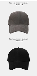 Close-up of solid grey and black cotton baseball caps with a classic six-panel design