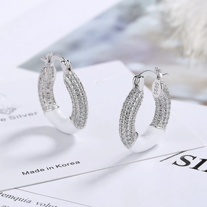 Sparkling S925 silver donut hoop earrings with pavé zircon stones and white enamel detail