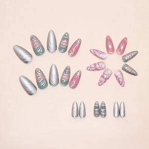 Detail view of silver relief texture and Y2K butterfly wings on 3D press-on nails