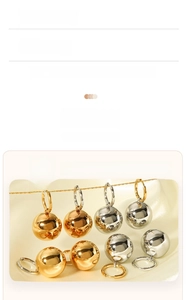 Detail view of 18K gold plated hollow ball earrings showing 8.2g weight and plating spec
