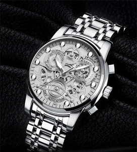 Macro detail of silver skeletal dial with luminous hands and 500M water resistance