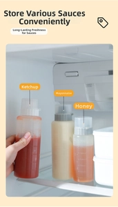 Detail of 5-hole clear plastic squeeze bottles with 250ml scale for sauces in a fridge
