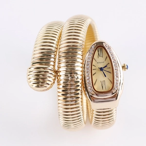 Elegant gold snake wrap watch for women with sparkling crystal bezel and teardrop dial
