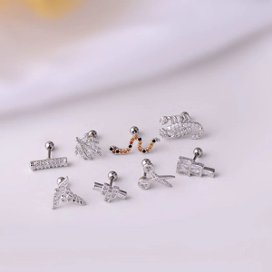 Set of 8 silver titanium steel cartilage studs featuring snake, leaf, and zircon designs