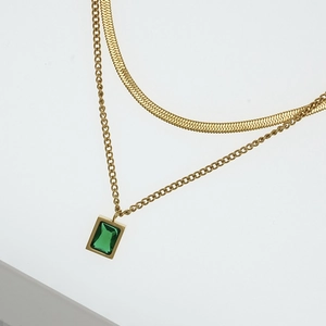 Elegant gold double-layered necklace featuring a square emerald pendant and snake chain