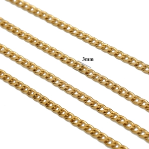 Macro view of 3mm golden stainless steel NK chain links showing texture and width