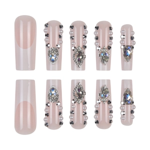 French tip press-on nails with luxury pearls and rhinestones on soft pink base