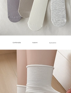 Detail view of comfortable autumn cotton crew socks in purple, coffee, cream and grey