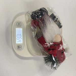 Christmas gnome doll with lantern and knit sweater, weighing 106.4g for holiday decor
