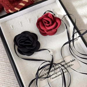 French retro fabric rose choker with black ribbon and pearls in a wooden jewelry box