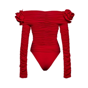 Detailed close-up of dark red ruched bodysuit featuring 3D floral accents on shoulders