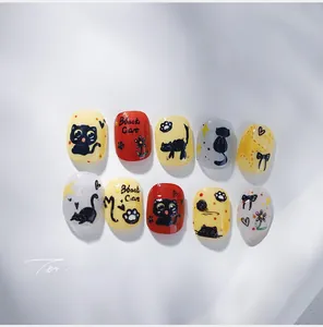Detail of 10-piece cartoon black cat nail art stickers with floral and star patterns