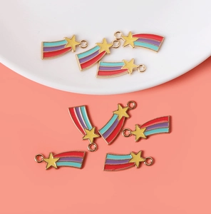 Detailed close-up of nine enamel rainbow star pendants for DIY jewelry making and crafts